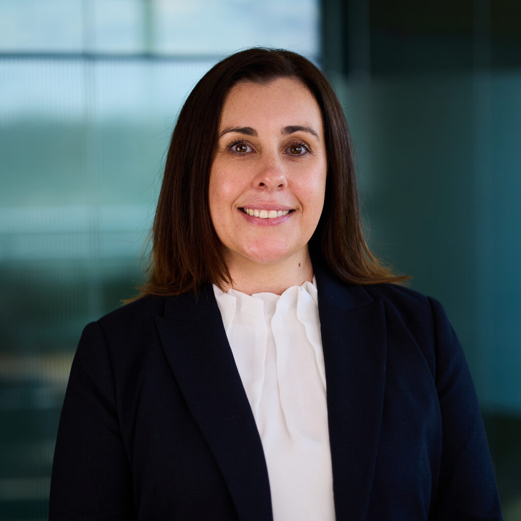 WorkCover solicitor at Richardson & Lyons standing indoors, representing expertise in Brisbane personal injury law.